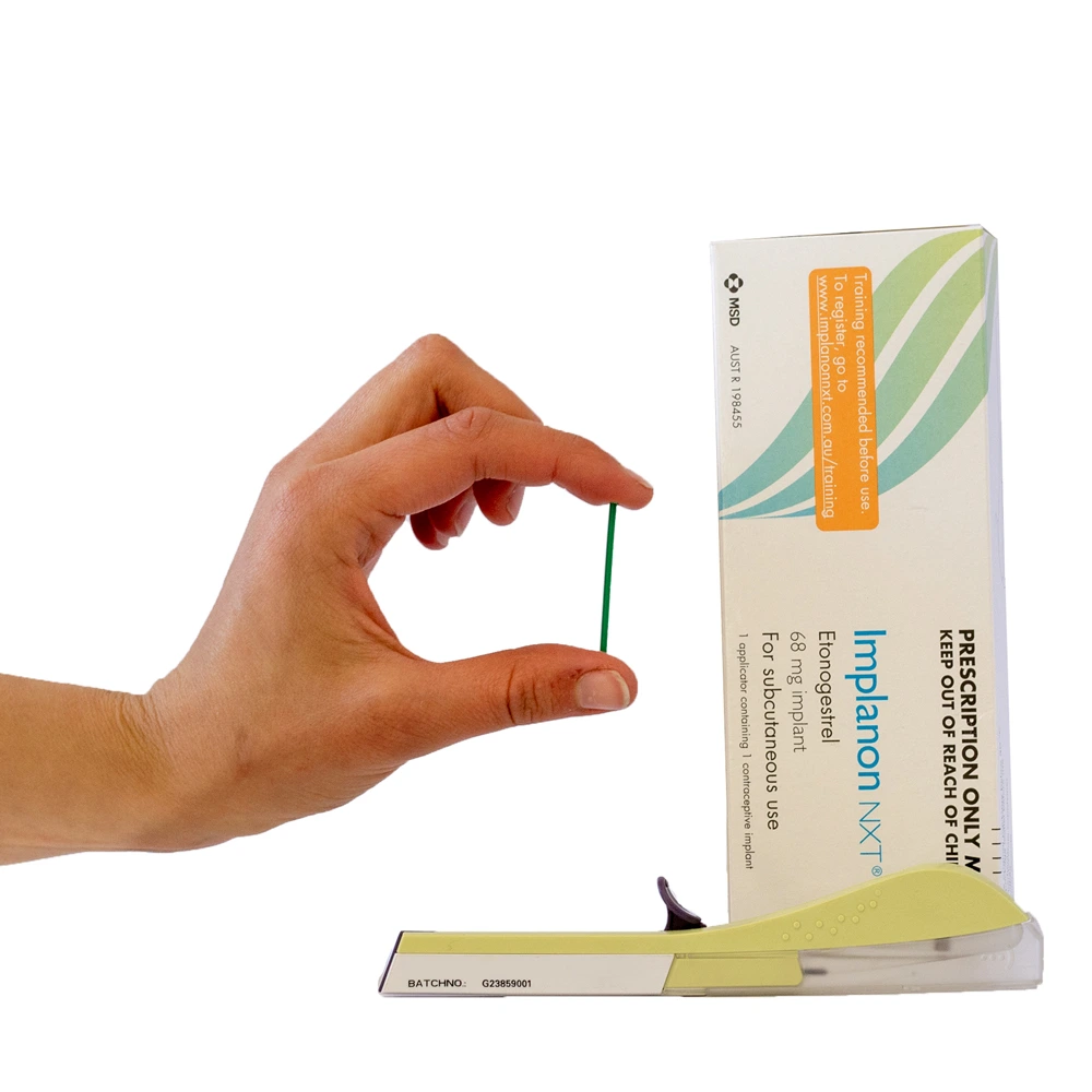 Doctor inserting contraceptive rod in arm