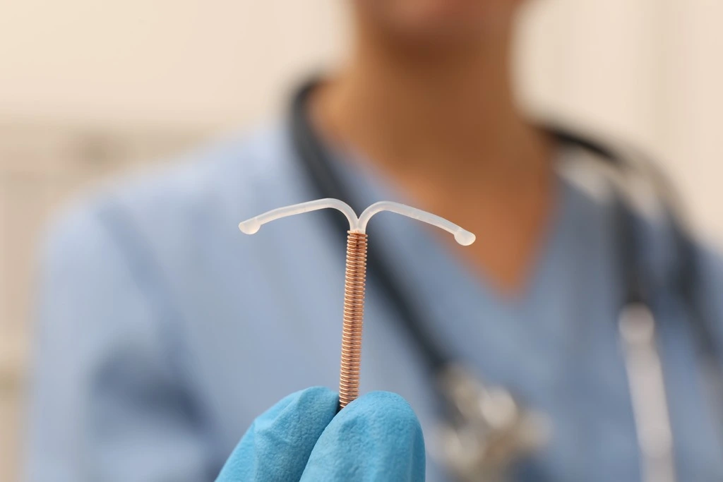 Doctor holding an IUD contraceptive device