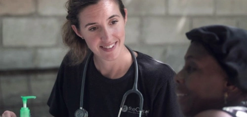 Doctor smiling during a patient check-up at Harpley Doctors