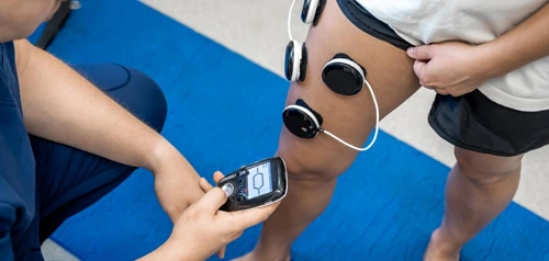 Athlete being treated with electrodes